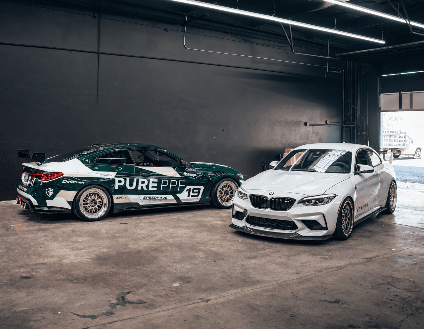 Two BMW performance builds inside the new Speedhaus Automotive workshop
